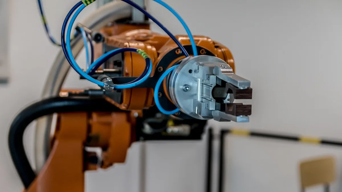 A robotic arm working in an automated production setting