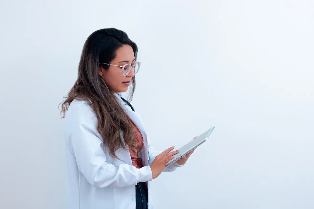 A clinician writing up patient notes
