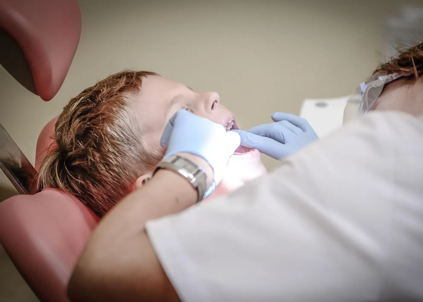 A dentist treating a patient in a modern surgery